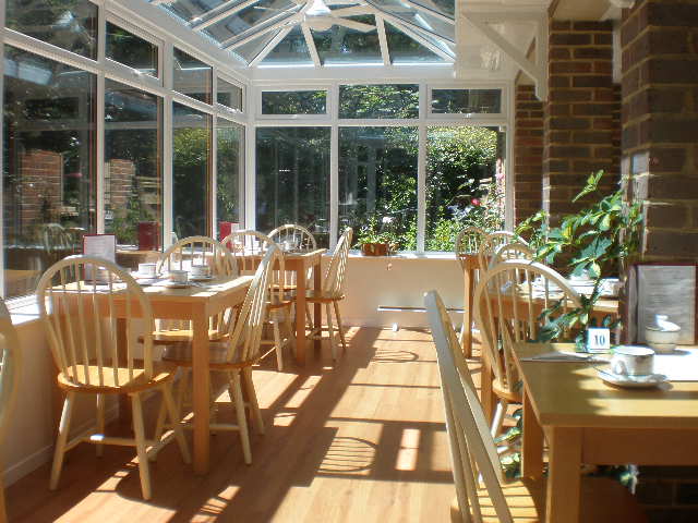 inside the sunny Orchard Tea Room tables and chaors are ready for guests