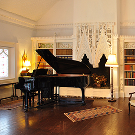 The piano in the Victorian music room - links to the concerts and events page