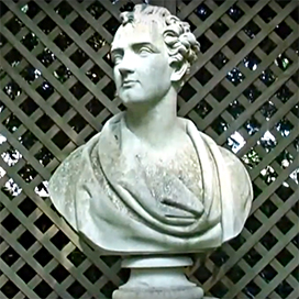 Image of a stone bust sculpture linking to a video about the house and gardens